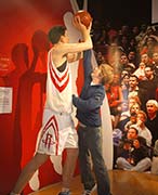 Alberty pretending to block Yao Ming at a wax museum in Hong Kong