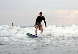 Seth Alberty catching a wave at Kuta Beach in Bali, Indonesia