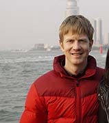 Seth Alberty in puffy coat at Xiamen crossing strait on ferry