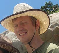 Seth Alberty at China beach wearing a cool brimmed beach hat